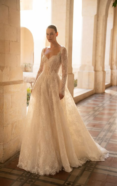 Lee Petra Grebenau Spring 2025 bridal collection. The Audrey wedding gown, a princess gown with a long train and long sleeves, intricately crafted from luxurious lace and adorned with delicate sequins to add a touch of sparkle.. #leegrebenau #luxurybridal #bridal2025 #couturebridal #luxurywedding Long Sleeved Wedding Dress Lace, A-line Wedding Dress Lace, Long Sleeve Lace Wedding Dress A Line, Lace A Line Wedding Dress With Sleeves, Traditional Long Sleeve Wedding Dress, Long Sleeve Wedding Dress A Line, A Line Long Sleeve Wedding Dress, Wedding Dress A Line Lace, Classic Lace Wedding Dress