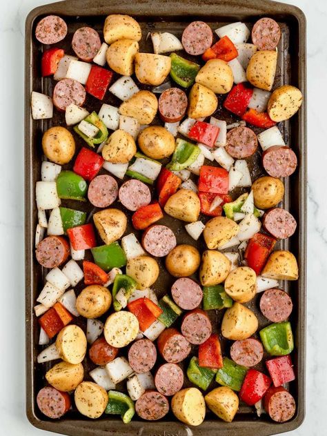 You'll love this easy Sheet Pan Sausage and Potatoes recipe! Sausage and baby gold potatoes bake on one pan with just 5 minutes of prep and easy cleanup! Sausage Potato Sheet Pan Dinner, Sheet Pan Sausage And Potatoes, Baby Gold Potatoes, Sausage And Potato Bake, Sheet Pan Sausage, Pan Sausage, Sausage And Potatoes, Spinach Alfredo, Sheet Pan Suppers