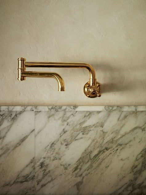 brass pot filler in kitchen with marble backsplash and plaster walls Light Wood Flooring, Brass Pot Filler, Hoarder House, Colonial Modern, Limewash Walls, European Lifestyle, Vintage Brass Chandelier, Calacatta Viola Marble, Chocolate Stains