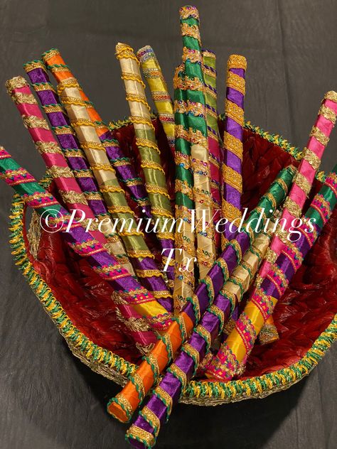 "NO RETURN - NO EXCHANGES - CANCEL ORDERS WITHIN 12 HOURS * HANDMADE - WE HAND MAKE EVERYTHING HERE LOCALLY IN TEXAS, USA! * Assorted Colors & Designs * Set Includes: * 6 pairs = 12 Dandiyas * 12 Pairs = 24 Dandiyas * 18 Pairs = 26 Dandiyas * Randomly Selected Design * Dimensions: 14.5-15\" approximately * Great for any occasion and can be given as giveaways/favors to guests * They are made of heavy duty wood sticks that won't break easily and is easy to hold. * These are decorated with Satin Ri Mehndi Favors For Guests, Dholki Party Favors, Mayun Decoration, Mendhi Favors, Pakistani Mehndi Decor, Dholki Ideas, Pakistani Sweets, Dholki Decor, Dandiya Sticks