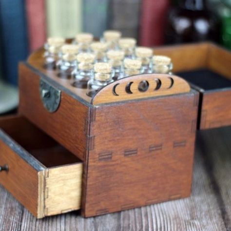 Wooden apothecary chest/storage box with drawer, comes with 12 glass bottles, cork stoppers and labels: ($92-$105) Sold by: https://www.etsy.com/shop/ReginaldSpleen Item in picture: https://www.etsy.com/listing/1073555316/wooden-apothecary-chest-with-drawer-for #wood #woodwork #apothecary #woodenchest #chest #storagebox #potionbottlebox #potionbottles #corkedbottles #drawerchest #etsy #etsyfinds #etsyshop #etsy Essential Oil Storage Box, Apothecary Chest, Chest Storage, Essential Oil Storage, Herbs Spices, Blank Labels, Oil Storage, Bottle Box, Wooden Chest