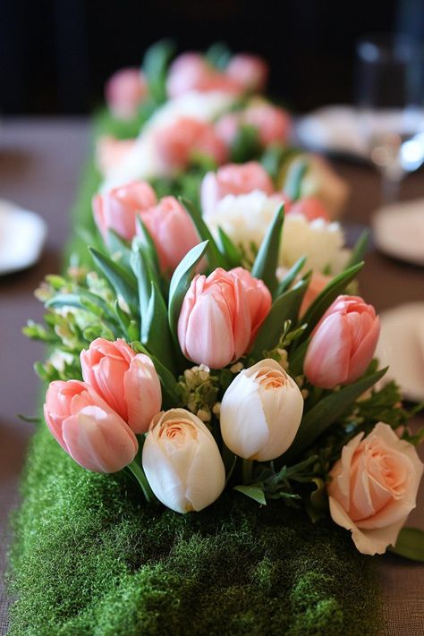 Pink and white tulips in a lush green arrangement. Unearth a treasure trove of vibrant and whimsical ideas to sprinkle your spring wedding with the season’s unique charm and charisma. Spring Tulip Wedding, Spring Wedding Decor Ideas, Pink And White Tulips, Tulips Wedding, Spring Wedding Decor, Tulip Wedding, Easter Wedding, Spring Wedding Decorations, Rustic Wooden Table