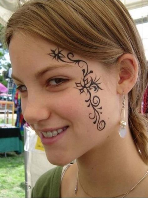 Face Tattoo Ideas | Designs for Face Tattoos Face Henna, Swirly Tattoo, Head Tattoo Design, Face Tattoo Ideas, Small Face Tattoos, Tattoos About Mom, Unique Tattoos Black Women, Tattoos For Moms With Kids, Face Tattoos For Women