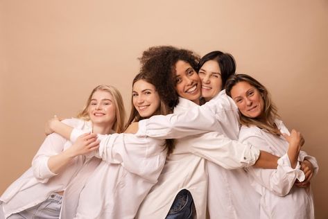 Free photo different interage women in w... | Free Photo #Freepik #freephoto #diverse-women #woman-group #women-together #african-model Hug Each Other, Woman Stock Photo, Women In White, Beige Background, White Shirts, Vector Photo, Free Photo, Free Photos, Stockholm