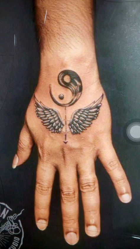 Tatoos Men Hand Arm, Hand Wings Tattoo, Wings Tattoo On Hand, Hand Tattoos For Boys, Fist Tattoo Ideas For Men, Boys Tattoo Hand, Small Tattoos For Guys Forearm, Mom Tattoo For Men, Hand Tattoos For Guys Ideas