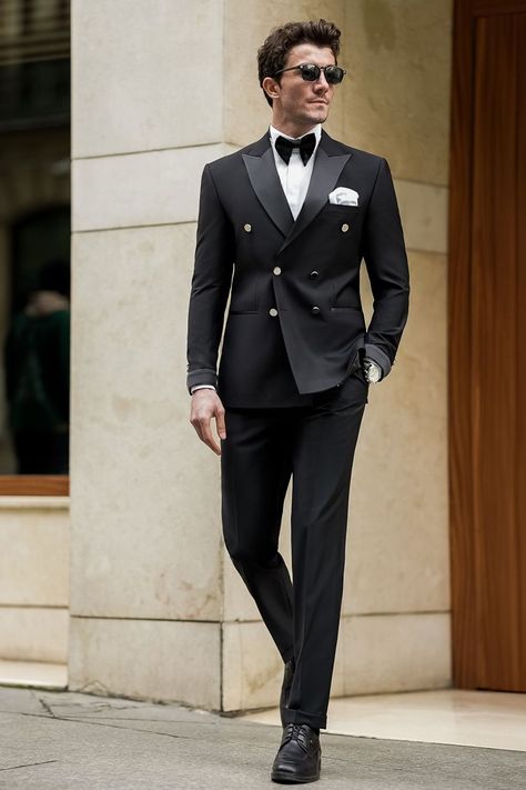 Our Black Tuxedo, crafted with meticulous attention to detail, this ensemble boasts a double-breasted jacket adorned with sleek satin lapels and subtle, modern touches. Paired with impeccably tailored trousers. Whether you're commanding the boardroom or stealing the show at a high-profile event, this tuxedo ensures you exude confidence.  #singlebreasted #suit #suits #slimfit #menstyle #menfashion #fashioninspo #formalwear #menclothing #formalattire #tuxedo #tuxedos #blacktuxedo Black Tuxedo Suit For Men, Groom Outfit Black Suit, Double Breasted Black Tuxedo, Best Tuxedo For Men, Double Breasted Tuxedo Wedding, Men Tuxedo Styles, Black Tuxedo For Men Classy, Double Breasted Suit Men Classy, Blazers For Men Wedding Suits