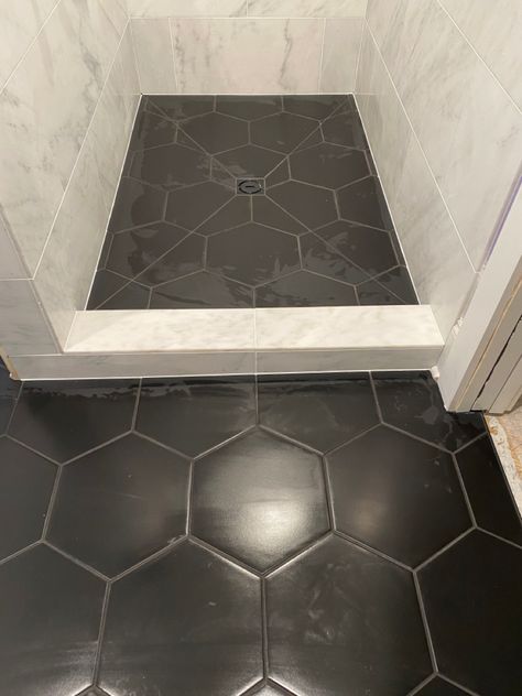 Marble Shower Black Floor, Black Hexagon Tile Bathroom Floor Ideas, Marble Shower With Black Floor, Shower Tile Ideas Dark Grout, Black Marble Hexagon Tile Bathroom, Dark Tile Shower Floor, Black Hexagon Tile Shower Floor, Black Shower Floor Tile Ideas, Black Hexagon Shower Floor