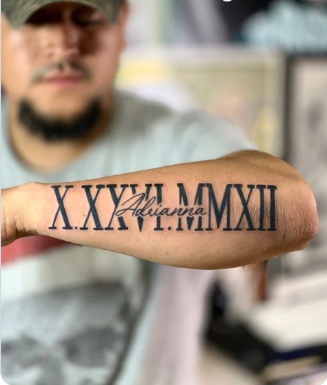 Roman Numerals And Name Tattoo, 1972 Tattoo Roman Numerals, Cool Name Tattoos Ideas, Roman Numeral With Name Tattoo, Name And Roman Numeral Tattoo, Forearm Roman Numeral Tattoo, Birthday In Roman Numerals Tattoo, Name Tattoos Men, 2004 Tattoos