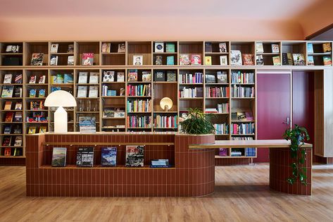 SJB writes a new chapter for UNSW Bookshop | IndesignLive Digital Retail, Curved Mirror, Australian Interior, Australian Interior Design, Reception Counter, Interior Design Awards, Retail Experience, Shop Front Design, Built In Bench