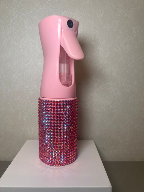 Pink bedazzled spray bottle perfect for hair care!