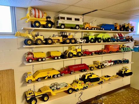 Tonka Truck Storage Kids Rooms, Tonka Truck Storage Ideas, Tractor Toy Storage, Bruder Truck Storage, Toy Truck Organization, Large Toy Truck Storage Ideas, Toy Truck Storage Ideas, Dj Bedroom, Boy Toy Storage