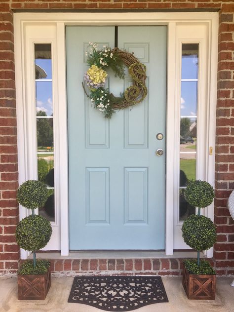 Blue front door with topiary. Door color is Wedgewood Gray by Benjamin Moore Blue Front Door Brick House, Homes With Red Brick, Front Door With Wreath, Light Blue Front Door, Wedgewood Gray, Brick House Front Door Colors, House Doors Colors, Pretty Doors, Diy Topiary