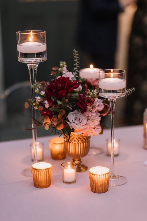 I love thinking about how the candle flames will light up those centerpieces when the sun has set. With those deep reds and pinks, it will surely create a deeply romantic night. ⁠ Floating Candle With Flowers, Table Centerpieces For Dinner Party, Romantic Small Wedding, Pink Party Centerpieces, Candle And Flower Centerpieces, Rose Table Centerpiece, Floral Table Decor, Wedding Business Ideas, Candlelit Wedding