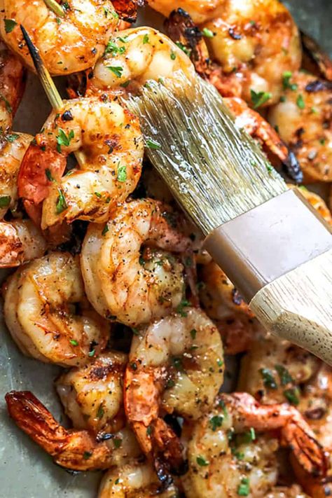 Garlic grilled shrimp skewers are a summer staple, perfect for the grill! Brush the shrimp in this tangy marinade for a delicious shrimp kabob or enjoy it tucked into a zesty shrimp taco. This recipe is my summer go-to! #spendwithpennies #grilledshrimp  #shrimponthegrill #garlicgrilledshrimp Shrimp Marinade For Grill, Shrimp Kabobs On The Grill, Holiday Seafood Recipes, Grilled Shrimp Marinade, Easy Grilled Shrimp Recipes, Shrimp Skewer Recipes, Grilled Kabob Recipes, Bbq Pork Recipes, Shrimp Kabobs