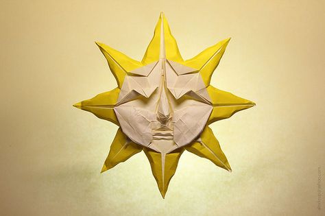 Origami sun by Peter Engel. This design looks somewhat complex, but I like the use of the more artistic sun rendition (the use of a face within the centre of the sun). Origami Sun, Sun With A Face, Neve Tzedek, Origami Artist, Origami Models, Book Origami, Food Carving, Origami Design, Design Posters