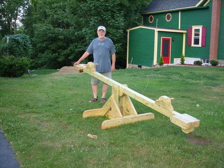 Another seesaw design.  I like the heavier lumber to match the swing set. See Saw Design, Science Games For Kids, Kids Seesaw, Play Outdoor, See Saw, Teeter Totter, Kids Outdoor Furniture, Diy Playground, Cornhole Game