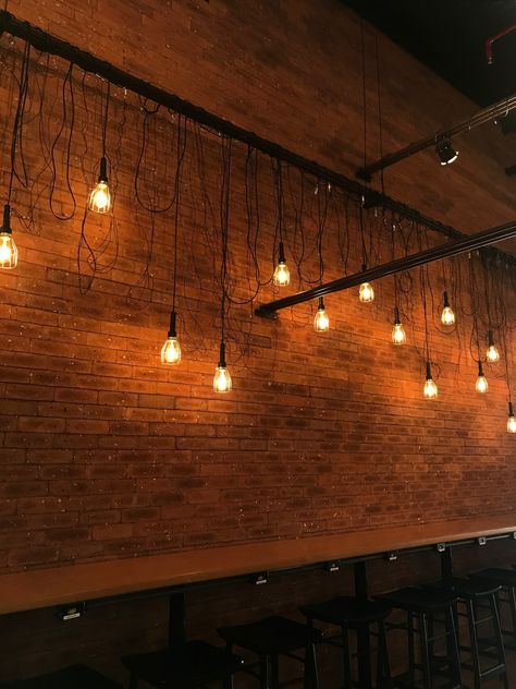 Industrial Brick Wall Bar, Brick Wall Lighting, Exposed Brick Interior, Event Space Decor, Rustic Industrial Lighting, Coffee House Design, Church Lobby, Brick Interior Wall, Winery Tasting Room