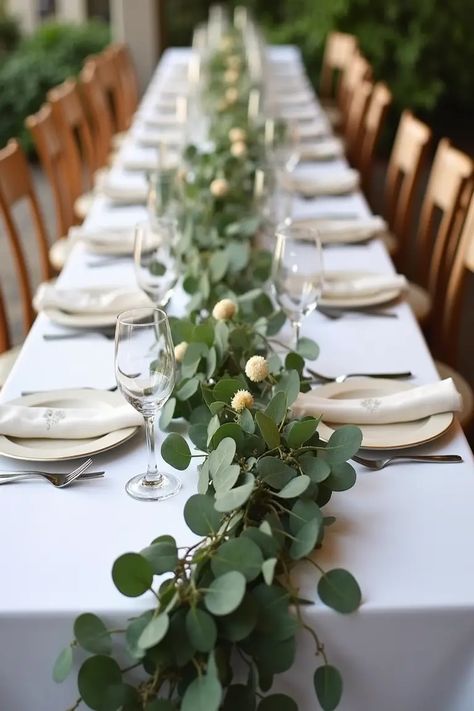 22 Simple Wedding Centerpieces That’ll Wow Your Guests Table Decorations With Eucalyptus, Table Runner With Eucalyptus, Fake Greenery Wedding Centerpieces, Simple Table Decorations Wedding Budget, Greenery For Wedding Tables, Eucalyptus Table Centerpiece, Simple Long Table Centerpieces, Herb Centerpiece Wedding, Simple Wedding Centerpieces Long Tables