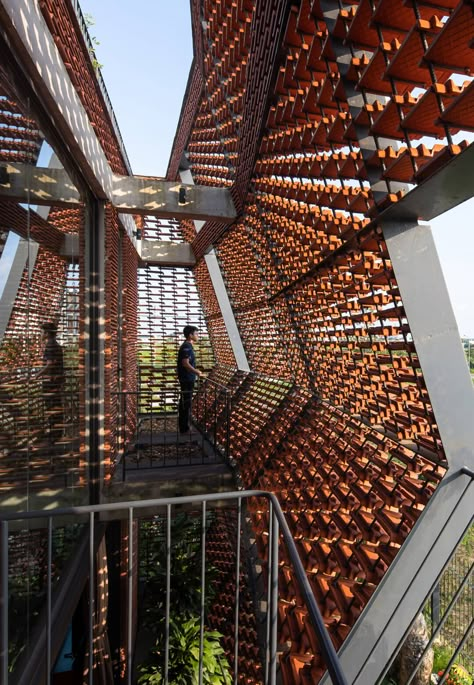 The Tile Nest house in Vietnam is a sculpturesque form in local clay tiles Shigeru Ban, Facade Architecture Design, Brick Architecture, Architecture Building Design, Architecture Concept Drawings, Architecture Design Concept, Clay Tiles, Brick Design, Terracotta Tiles