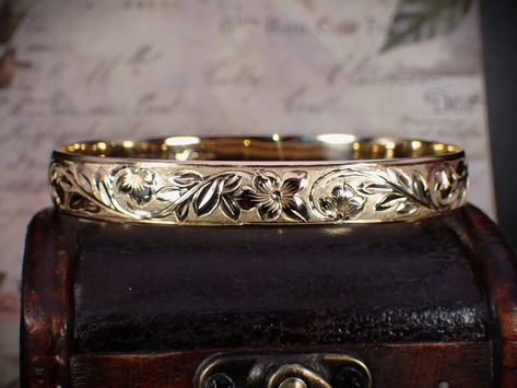 This exquisite treasure is a 14K solid yellow gold Hawaiian wedding bracelet with the absolutely stunning and traditional plumeria floral carving. The bangle is marked "RHHJ (Royal Hawaiian Heritage Jewelry) 14K". The opening measures approx. 2-3/4" in x 2-5/16". Approx. 7-3/4" in circumference and 3/8" (9.85mm) wide. #finegoldjewelry #floral #plumeria #hawaiian #wedding #bracelet #carved #gold #bangle #sawdustfinery #shopsmall #giftideas #anniversary #justlisted #etsyseller #etsy Heritage Jewellery, Fine Gold Jewelry, Hawaiian Wedding, Jewelry Fashion Trends, Gold Bangle, Wedding Bracelet, Solid Yellow, Diamond Bracelet, Gold Bracelet