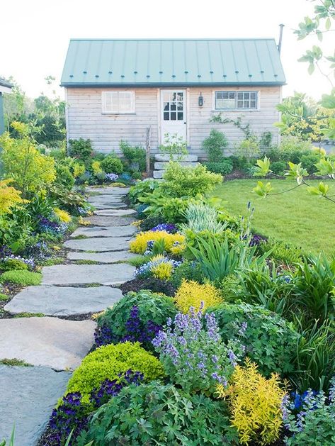 Purples and yellows supply a flowerbed with subdued color.Narrower beds are easier to access from both sides, making them easier to maintain.Repeating plants and colors, shown here in a planting of cranesbill and coralbells, fills a pretty flower border.Mounding plants maintain a view of the rest of the garden.To create a more casual appeal to the garden, flowers and shrubs are left to grow in a natural pattern.The foliage of bearded iris offers vertical visual interest to the garden. Walkway Design, Walkways Paths, Stone Path, Have Inspiration, Garden Pathway, Architecture Portfolio, Garden Cottage, Landscape Projects, Front Garden