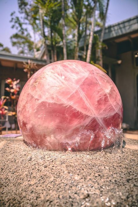 This foundation is out of this world!!!  The rose quartz sphere spins each and every day, and sits in the centre of the courtyard as the heart of the Crystal Castle in Australia.   Photo & Info: Crystal Castle Aesthetic Rose Quartz, Crystal Necklace Aesthetic, Rose Quartz Aesthetic, Quartz Aesthetic, Crystal Castle, Crystal Aesthetic, Crystals In The Home, Quartz Sphere, Crystal Art