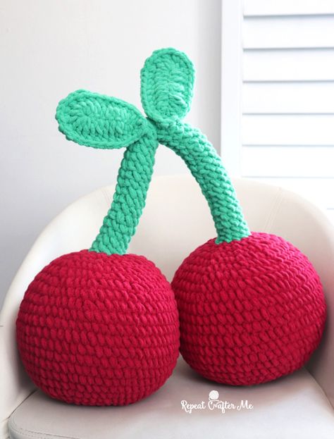 A pair of cherries that are big enough and plush enough to be an accent pillow! Great decor for a dorm room, kids bedroom, or an arm chair. Grab that Bernat Blanket Brights yarn in colors Race Car Red and Go Go Green! This pattern works up quickly with a size J hook. Together they … Bernat Super Value Yarn, Crochet Gingerbread, Cow Hat, Granny Stripe, Crochet Leaf, Stripe Crochet, Repeat Crafter Me, Baby Shawl, Crochet Fruit