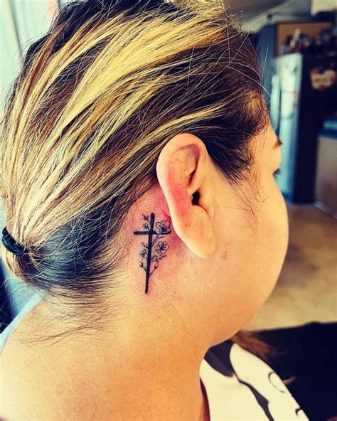 feminine cross tattoo behind ear Christian Behind Ear Tattoo, Cross Tattoos Behind Ear, Cross Tattoo Behind Ear, Visionary Tattoo, Cross Behind Ear Tattoo, Back Ear Tattoo, Feminine Cross Tattoo, Small Cross Tattoo, Tattoos Behind Ear