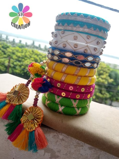 It's Handmade products Available on order My New Collection Navratri Bengals, Fabric Bangles Handmade, Jewellery For Navratri, Bangles Craft, Cork Garland, Navratri Jewellery, Cloth Jewellery, Fabric Bangles, Silk Thread Bangles Design