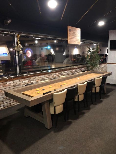 Grey oiled rustic old oak 14ft shuffleboard in a bowling center in front of a bar. Made by Shuffly Basement Shuffleboard, Diy Shuffleboard Table, Shuffle Board Table, Shuffle Board Table Top, Table Shuffleboard, Shuffle Board, Oak Beams, Bowling Center, Shuffleboard Table