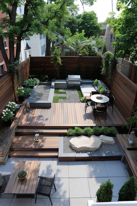 Modern backyard with wooden decking, seating area with green cushions, dining table, grill, and lush landscaping featuring trees and plants. Backyard Exterior Design, Modern Terraced Landscaping, Garden Contemporary Design, Modern Trex Deck Ideas, Backyard Patio Designs Modern, Modern Deck Design Backyards, Modern Backyard Patio Designs, Outside Landscape Ideas, Backyard Spaces Ideas