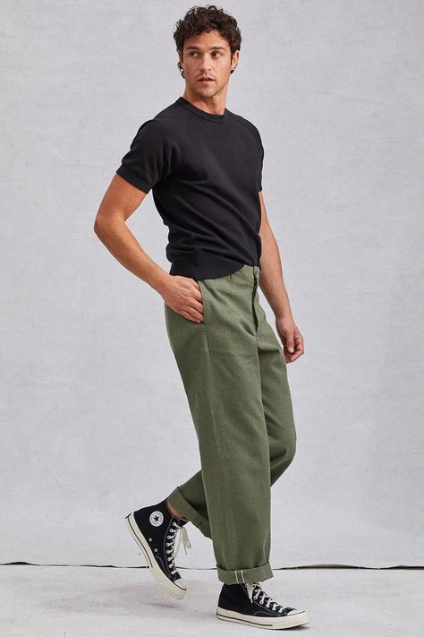 Men's olive green workwear pants with black t-shirt and high tops outfit. This outfit first appeared in the article: Men’s Green Pants Outfit Inspiration: 14 Modern Looks For 2022, on MensFlair.com Olive Green Pants Men, Green Pants Outfit Men, Mabel Outfits, Olive Pants Men, Green Trousers Outfit, Olive Pants Outfit, Olive Green Pants Outfit, Chinos Men Outfit, Trousers Outfit Men