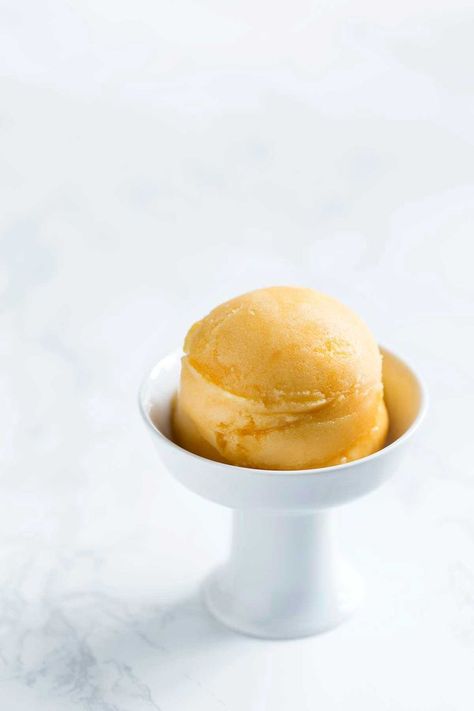 This passion fruit sorbet recipe is so flavorful and incredibly easy to make. A perfect summer treat with only 3 ingredients! Get the easy-to-follow recipe from Savory Simple. Apricot Sorbet, Fruit Sorbet Recipe, Passion Fruit Sorbet, Scoops Of Ice Cream, Granitas, Apricot Recipes, Sorbet Ice Cream, Fruit Sorbet, Sorbet Recipes