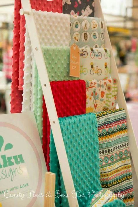 Baby blankets craft display. Blanket Display Ideas, Remove Grass Stains, Craft Fair Booth, Craft Stall Display, Show Ideas, Craft Fair Booth Display, Scarf Display, Craft Show Booths, Craft Show Booth