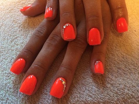 Neon Orange Nails With Glitter, Neon Nails With Gems, Bright Neon Orange Nails, Orange Nails With Rhinestones, Mcbling Nails, Neon Coral Nails, Nails With Gems, Bright Orange Nails, Nails With Charms