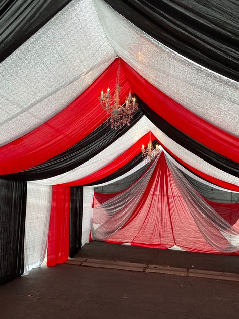 Elevate your event with our stunning draped tent decor. ✨ Create a magical atmosphere with #EventDecor #PartyPlanning #TentDraping #eventdecor #redandblack tent draping Red And Silver Decorations, Party Tent Decorations, Draped Tent, Tent Draping, Silver Decorations, Tent Decor, Tent Decorations, 30th Bday, Red Party