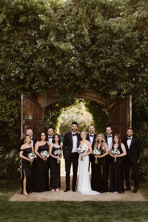 Black Bridal Party Dress, Wedding Guests Black Outfits, Industrial Wedding Bridesmaids Dresses, Black Bridesmaids And Groomsmen Attire, Black Attire Bridal Party, Black Bridesmaid Dresses With Black Tuxedos, Wedding Party Black Suits, Black Tie Wedding Party Attire, Black Bridal Party Attire Summer