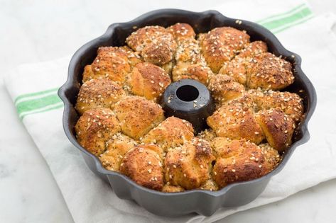 Everything bagel monkey bread 12 Tomatoes Everything Bagel Monkey Bread, Everything Monkey Bread, Everything Bagel Monkey Bread 12 Tomatoes, Everything Bagel Monkey Bread, Savory Monkey Bread Recipe, Savory Monkey Bread With Canned Biscuits, Monkey Bread Savory, Bagel Bake, Potluck Party Food