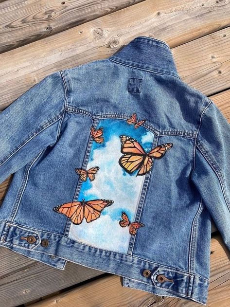 Just finished up this beautiful painting orderIt was such a pleasure to work on this piece and bring my client's vision to lifeI'm so happy with how it turned out and I hope they love it just as muchThankyou for trusting me with your projectGet your favorite denims painted as you wish to give them a new unique lookContact us 8780038987 sajdawithchandni painting art commission happycustomerhandmadewithlove Sunflower Painted Jean Jacket, Butterfly Jean Jacket, Hand Painted Fashion, Back Of Jacket Design, Jean Jacket Back Design, Hand Painted Clothing Diy, Painted Jean Jacket Ideas, Hand Painted Hoodie, Jean Jacket Painted