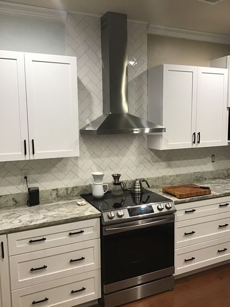 Kitchen Tiles Wall Backsplash Ideas Range Hoods, Tile Range Backsplash, Tile Behind Range Hood, Backsplash Behind Range Hood, Oven Range Hood Ideas, Tile Accent Wall Kitchen, Kitchen 2025, Herringbone Subway Tile, White Subway Tile Kitchen