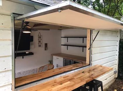 You Have to See This Amazing Tiny Shed Makeover Outdoor Kitchen Shed Ideas, Food Shed Ideas, Shed Entertaining Space, Small Shed Conversion, Storage Shed Bar Ideas, Backyard Bar Shed Diy, Shed Turned Into Bar, Shed With Bar Window, Bar Shed Ideas