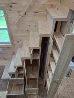 These Tiny House Stairs have plenty of storage. Three drawers, a large storage compartment, a broom closet, a pull-out pantry, and two small cupboards. Design Case Mici, Diy Tiny House Plans, Tiny House Stairs, Tiny House Storage, Diy Tiny House, Tiny House Interior Design, Small Cupboard, Loft Stairs, Tiny House Loft