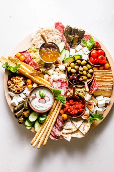 Mediterranean Charcuterie Board - Reluctant Entertainer Mediterranean Charcuterie Board Ideas, Indian Charcuterie Board, Mediterranean Charcuterie Board, Mediterranean Board, Mediterranean Charcuterie, Dips And Spreads, Board Night, Cheese Flatbread, Delicious Appetizer Recipes