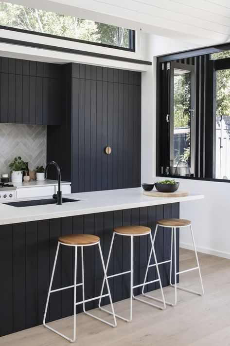 Dwell - A Bold Addition With a Zigzag Roof Ushers Light Into This Melbourne Home Clerestory Windows, Dark Kitchen, Melbourne House, Kitchen Splashback, Design Del Prodotto, Black Cabinets, Australian Homes, Kitchen Cabinetry, Counter Tops