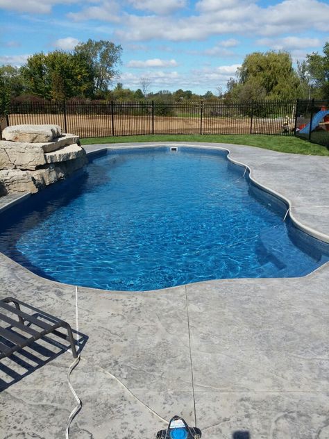 Fiberglass pool with stamped concrete deck by collee construction Stamped Concrete Around Inground Pool, Stamped Concrete By Pool, Inground Pool Concrete Ideas, Textured Concrete Pool Deck, Stamped Concrete Patio Ideas Pool Decks, Stamped Concrete Pool Deck Ideas, Pool Concrete Ideas, Concrete Around Pool Ideas, Pool With Stamped Concrete