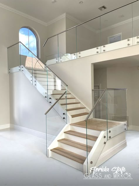 Glass Railings look amazing around a pool, balcony or accentuating an interior staircase. Call Us for a Free Estimate at 561-9976990 #glassrailing #glassrailings #railingsystems #railing #glassbalconyrailing #balconyrailing #laminatedglass #railings #railingdesign #glassinstallation #glazier #temperedglass #interiordesigns #staircase #staircasedesign #staircasedesigns #glassrailingstairs #designer #designers #contractor #contractors #glassandmirrorexperts #glassexperts #floridastateglass Stairs Tiles Design, Glass Staircase Railing, Glass Balcony Railing, Steel Stairs Design, Pool Balcony, Glass Railing Stairs, Balcony Glass Design, Glass Handrail, Wine Rooms