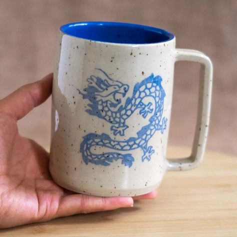 The wait is over - ceramics are finally coming to the shop this week! The restock will have almost 200 pieces looking for new homes and will release Friday, July 5 at 15:00 GMT+2 (patrons will get 30 mins early access). The only multiples I have this time are dragon and blue capybara mugs, meaning that all other listings are for individual pieces. So what you see in the photos is what you get 👏✨ A reminder that the restock can go quick, so you can check the preview on my website now. This w... Dragon Ceramics, Dragon Clay, Basement Studio, Swedish Design, Year Of The Dragon, Pitcairn Islands, Drawing Inspiration, My Website, One Pic