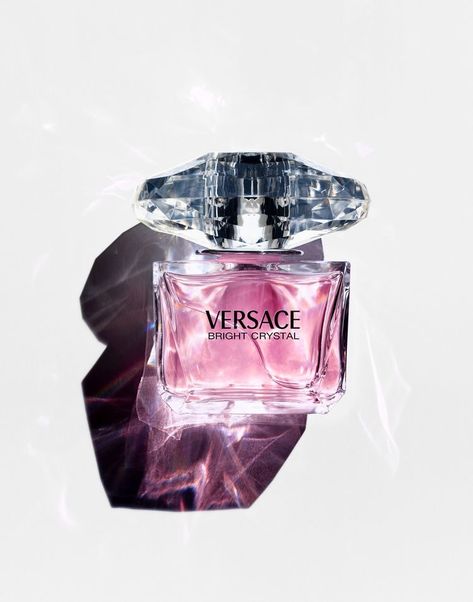 Bright Crystal perfume by Versace was inspired by a mixture of Donatella Versace's favorite floral fragrances, Bright Crystal is a fresh, sensual blend of refreshing chilled yuzu and pomegranate mingled with soothing blossoms of peony, magnolia, and lotus flower, warmed with notes of musk and amber. Notes include Iced Accord, Yuzu, Pomegranate, Peony, Magnolia, Lotus Flower, Acajou, Vegetal Amber, Musk. Decant Perfume, Versace Perfume, Fragrance Photography, Versace Bright Crystal, Bright Crystal, Perfume Photography, Perfume Samples, Perfume Scents, Perfume Lover