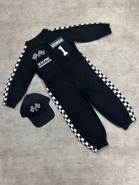 ⭐️Welcome to Mama's Dream Shop⭐️ 🏎️🏁This race car driver costume for kids is a professional Mama's Dream Shop design, featuring a jumpsuit with black and white checkered flag stripes on the details. Its front collar is reminiscent of real racing overalls, and unique patches adorn the front. You can wear this perfect racer outfit for your baby first birthday or Halloween. Race car birthday themed parties are so cool now. Your child will feel like a Formula-1 driver inside. Be prepared to hear p Racing Theme 1st Birthday Party, One Year Old Car Theme Party, Race Car 1st Birthday Photoshoot, Toddler Car Birthday Party, Racing Car Birthday Theme, Fast One Birthday Outfit, 3rd Gear Birthday Party For Boy, First Year Birthday Theme Boy, First Birthday Racing Theme