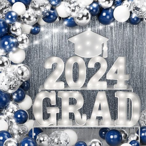 PRICES MAY VARY. 79 PCS GRADUATION PARTY FAVOR DECOR: Qinline 2024 graduation party decorations set includes 8 LED marquee light up letters “2024 GRAD” (NOT BATTERIES INCLUDED), 1 LED 'Doctoral hat', 16 X 10” midnight blue balloon, 16 X 10” sliver latex balloon, 10 X 10” white balloon, 10 X 12” sequins balloon, 2 foil curtain backdrop(3.3 x 6.7tf), 4 installation tools, 4 warm white led light strings. Add an element of fun to your party by using Qinline graduation light up table ornaments decora High School Graduation Party Table Set Up, Boy Graduation Party Decorations, Light Blue Grad Party Decorations, Blue And Silver Graduation Decorations, Royal Blue And Silver Graduation Party, Graduation Party Ideas Blue And White, Royal Blue White And Silver Balloon Garland, Navy Blue And Silver Graduation Party Decorations, Blue White Silver Graduation Decor